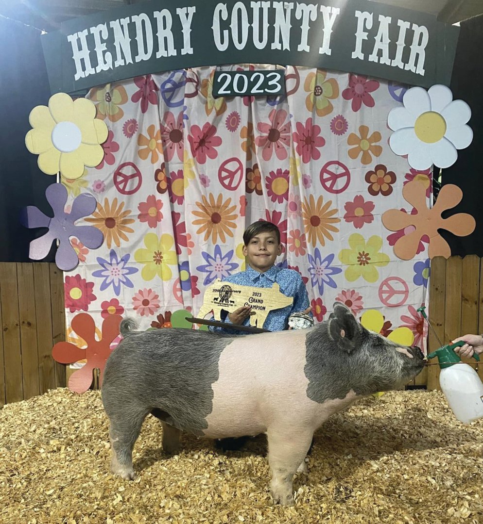 Jaxon Hernandez and his Grand Champion swine at the Hendry County Fair & Livestock Show